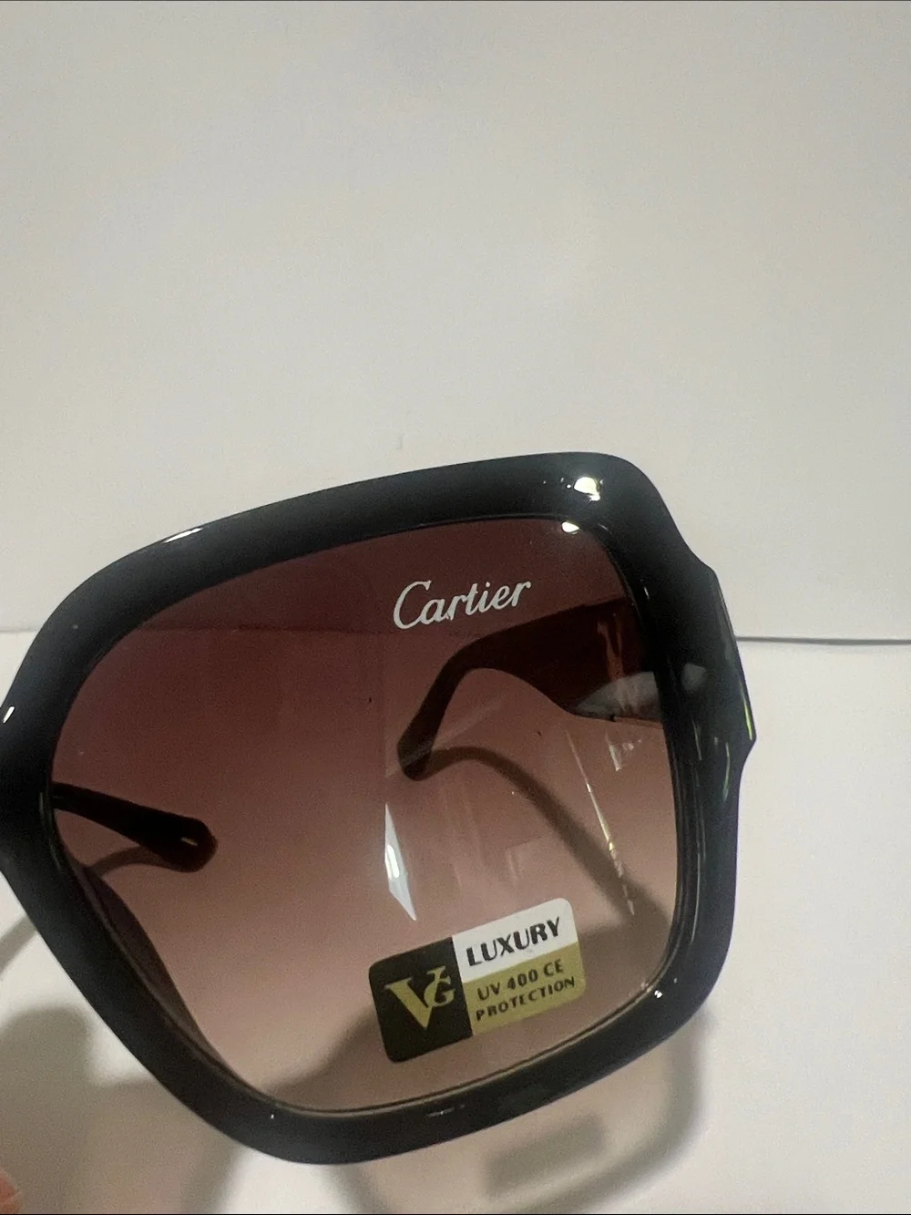 Cartier Women's Black Frame Sunglasses with Brown Gradient Lenses